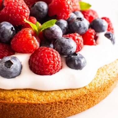 Almond flour cake with whipped topping, blueberries and raspberries.