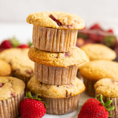 A stack of three almond flour strawberry muffins.