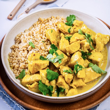 instant pot chicken curry in a bowl with brown rice