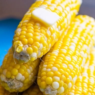 Instant Pot corn on the cob with a pat of butter on top.