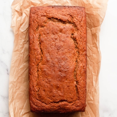 Protein banana bread loaf on parchment paper.