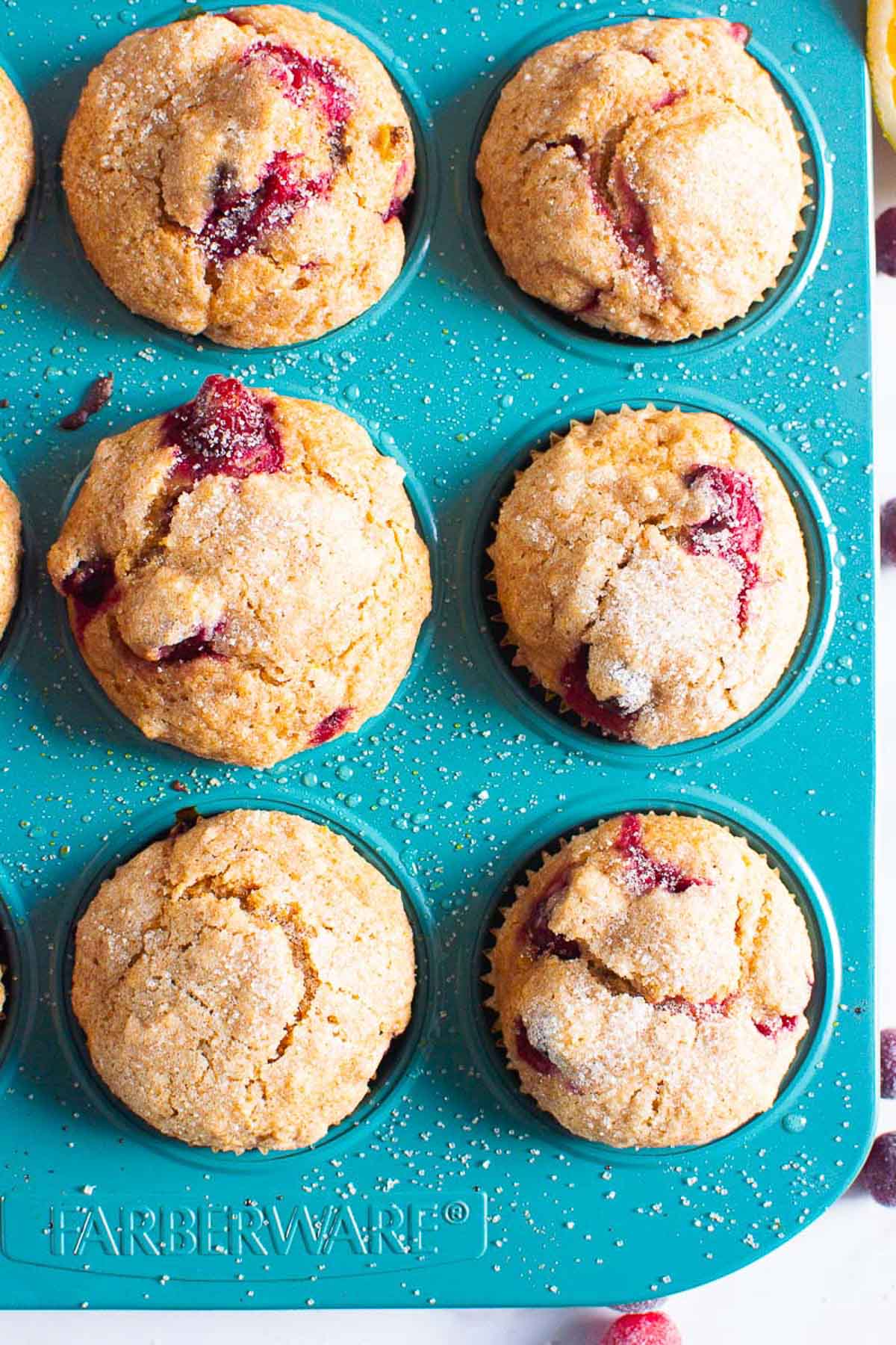showing 6 cranberry orange muffins in blue muffin tin