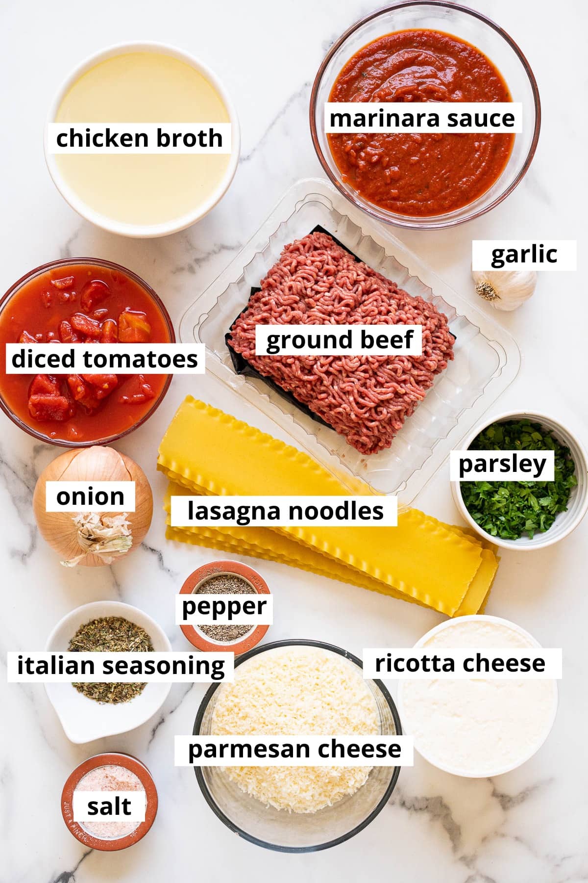 Ground beef, marinara sauce, chicken broth, diced tomatoes, garlic, onion, lasagna noodles, parsley, ricotta cheese, parmesan cheese, Italian seasoning, salt and pepper.