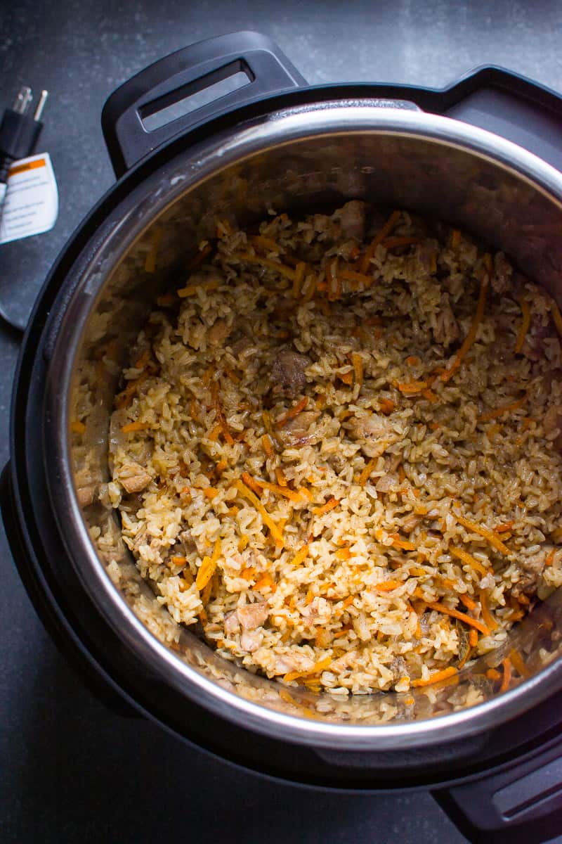 Instant Pot chicken and rice with carrots in a pressure cooker.