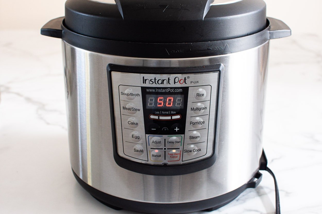 Instant Pot display showing 50 minutes manual cook time.