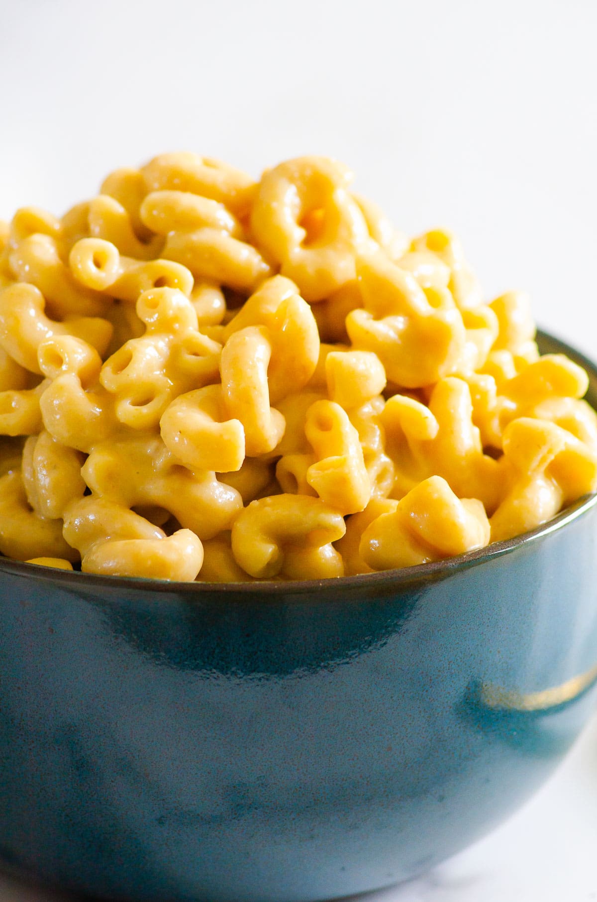 Side view of a bowl with mac and cheese.